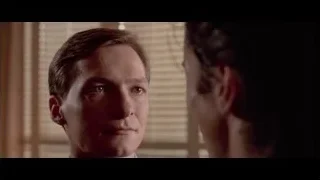 man in suit and tie looking serious — American Psycho