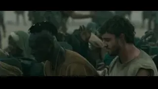 two men in crowded area — Gladiator 2