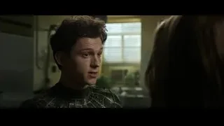 man in futuristic suit talking to woman — Spiderman: No Way Home