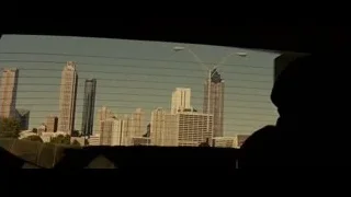 city skyline view from car window — Into the Wild