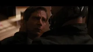 Two men in helmets in dimly lit room — Batman: The Dark Knight Rises