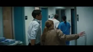Doctor explaining to patient in hospital room — Interstellar