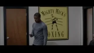 Men talking in gym — Creed