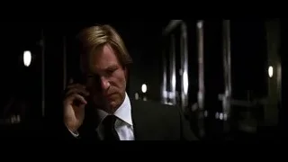 man in suit talking on phone in dark room — Batman: The Dark Knight