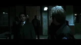 two men talking in dimly lit hallway — Batman: The Dark Knight