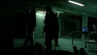 people working on laptop in dimly lit concrete room — Breaking Bad