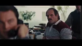 man in office talking on phone — The Wolf Of Wall Street