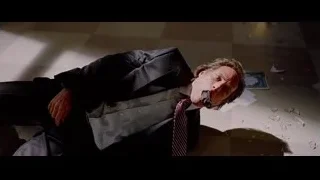 man in suit lying on floor — Batman: The Dark Knight