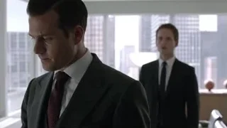 Two men in suits in office with city view — Suits