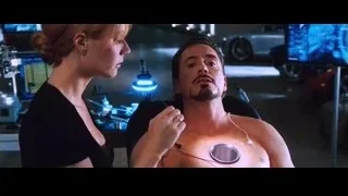 Man with stethoscope and woman in medical room — Iron Man