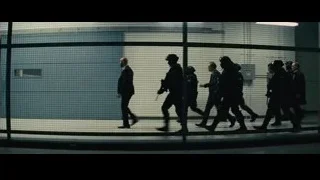 Armed men walking through hallway — Now You See Me