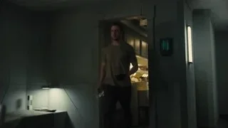 Dimly lit room with kitchen in background — Blade Runner 2049