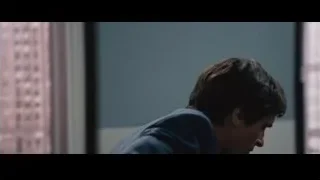 man in suit in front of Goldman Sachs sign — The Big Short