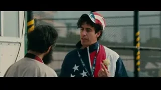 two men talking by a fence — The Dictator