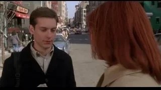 man and woman walking on busy street — Spider Man
