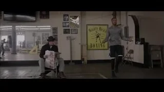 man reading newspaper in boxing ring — Creed