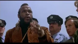Man in leather jacket with police officers — Rocky III