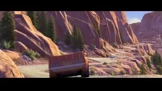 Winding road in desert with red rock formations — Cars