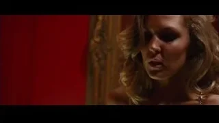 woman deep in thought by red wall — The Big Short