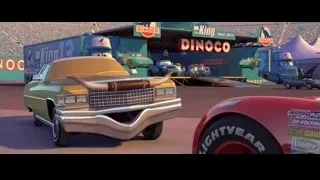 Mater car parked in front of King Dinoco truck — Cars