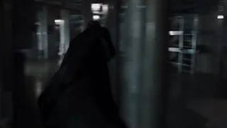 man walking through dark industrial hallway — The Avengers