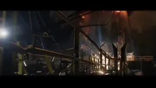 man holding yellow rope in dark room — Iron Man 3
