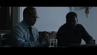 two men at table in dimly lit room — Southpaw