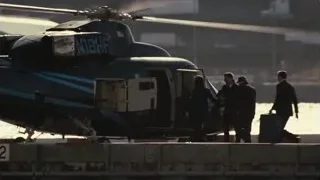people by black helicopter at sunset — Succession