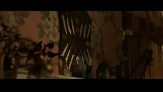 Black shield with knives on floral wall — Spiderman: No Way Home