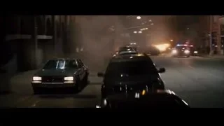 Police car on street with car in flames — Furious Seven