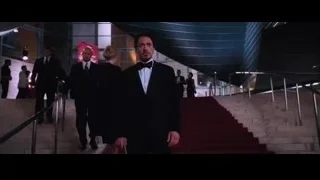 man walking down red carpeted staircase — Iron Man