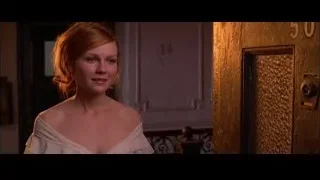 Woman in white dress by door — Spider Man 2