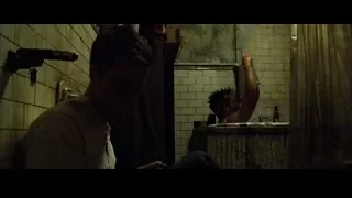 man sitting on floor in dimly lit bathroom — Fight Club