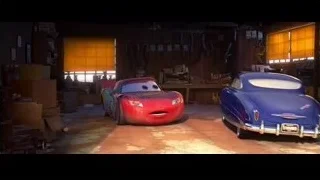two cars parked in garage — Cars