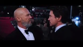 Two men in tuxedos on red carpet — Iron Man