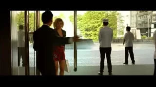 Woman in red dress at glass door — Lucy