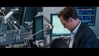 man in suit at desk with monitors — The Big Short