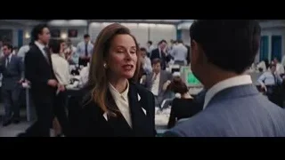 Woman in business suit talking to man in office — The Wolf Of Wall Street