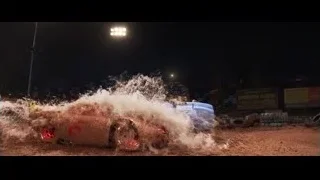 Red sports car driving on dirt track at night — Cars 3