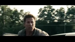 Yellow school bus driving through water — Superman: Man of Steel