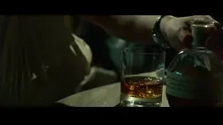 Elderly man holding whiskey in thought — John Wick