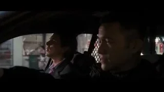 Two men in car's back seat — Batman: The Dark Knight Rises