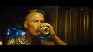 man in armor drinking from can — Deadpool 2