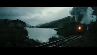 Train traveling through mountainous landscape at night — Harry Potter and the Goblet of Fire