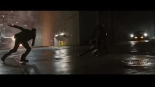 two men fighting on wet street at night — Furious Seven