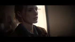 young woman's face in dark room — Interstellar