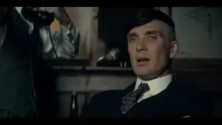 man speaking in dimly lit room — Peaky Blinders