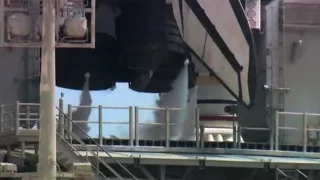 Industrial crane lifting large object — Elon Musk: Return to Space