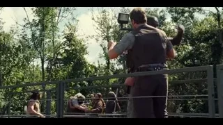 Two men standing on bridge — Jurassic World