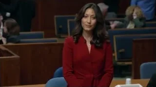 woman in red blazer speaking in courtroom — Suits